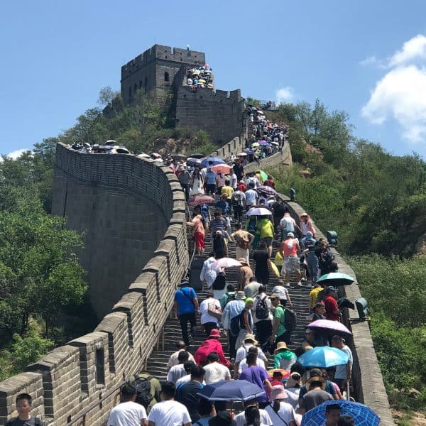 Badaling Great Wall with people climbing up towards a restored watchtower